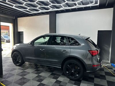 Polished dark grey Audi Q5 SUV with clean black alloy wheels