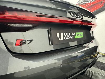 Close-up of polished Audi S7 chrome rings and taillight after detailing