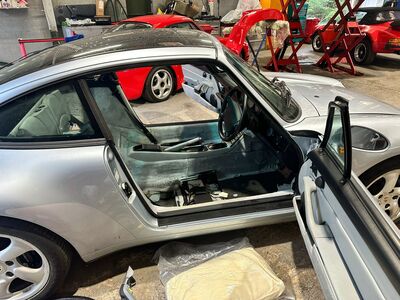 Classic silver Porsche 911 Coupe receiving interior detailing and polishing