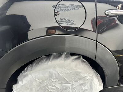 Rear quarter panel and fuel cap of a Mini Cooper showcasing ceramic coating paint protection